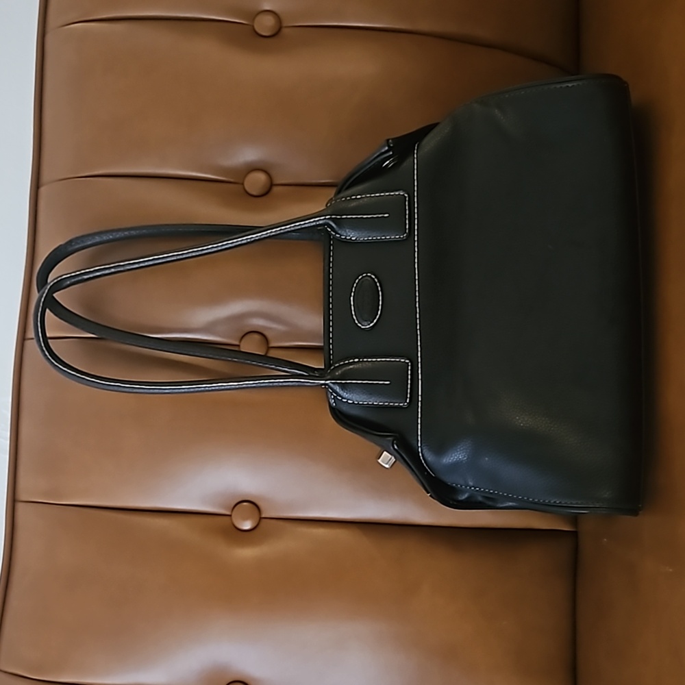 Sophisticated black purse with side detail buckles